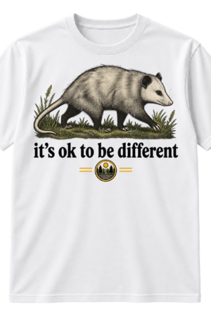 Vintage line-art opossum walking through grass above the text “it’s ok to be different,” with a National Geographic logo beneath.