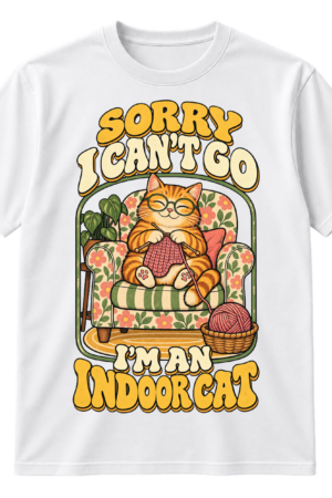 Vintage illustration of a glasses-wearing tabby cat knitting in a floral armchair with the text Sorry I Can’t Go I’m An Indoor Cat.