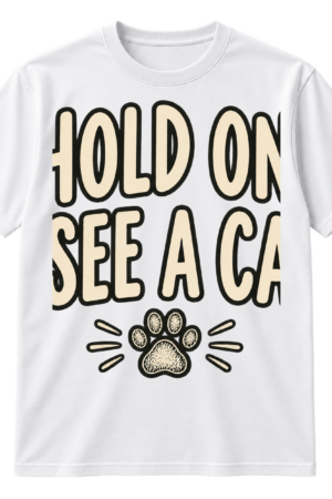 Handwritten text reading “HOLD ON. I SEE A CAT.” with a small sketched paw print underneath.