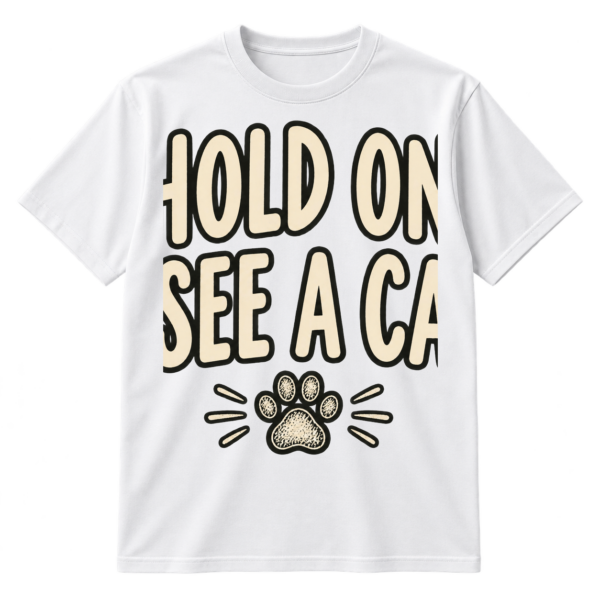 Handwritten text reading “HOLD ON. I SEE A CAT.” with a small sketched paw print underneath.