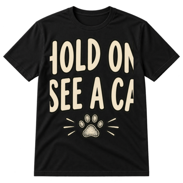 Handwritten text reading “HOLD ON. I SEE A CAT.” with a small sketched paw print underneath.