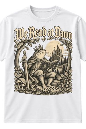 Vintage-style We Read at Dawn graphic with a crowned frog knight reading a book beside a sword, castle, moon, and leafy woodland frame.