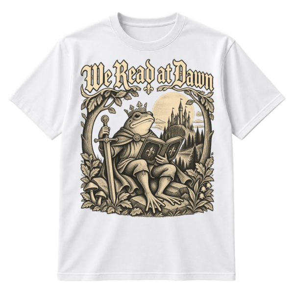 Vintage-style We Read at Dawn graphic with a crowned frog knight reading a book beside a sword, castle, moon, and leafy woodland frame.